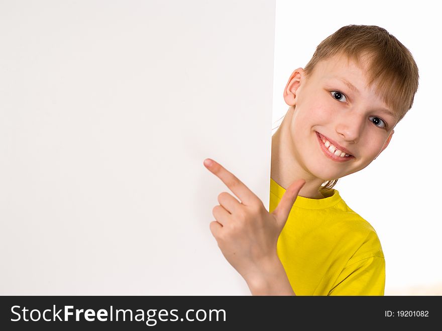 Smiling boy with a board on a white background