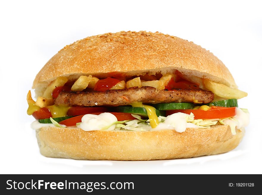 Hamburger with vegetables on white background