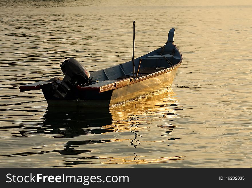 Fiberglass boat silhouette at early morning