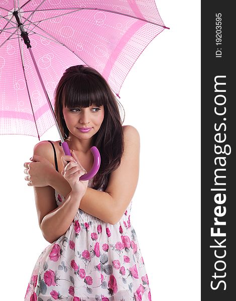Girl freeze under rose umbrella in summer dress