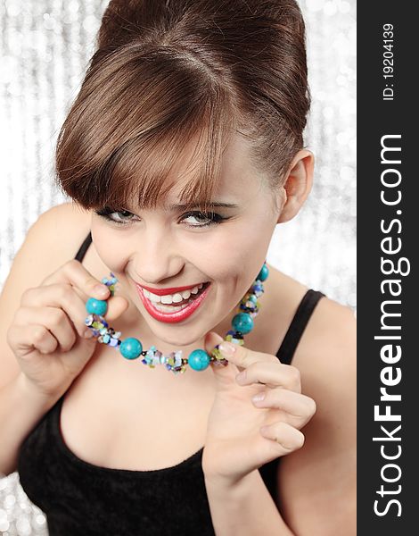 Happy young woman in the beads from turquoise. Happy young woman in the beads from turquoise