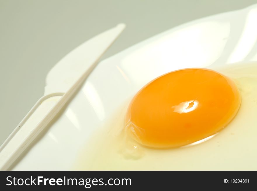 Whites and yolk on white plate. Whites and yolk on white plate