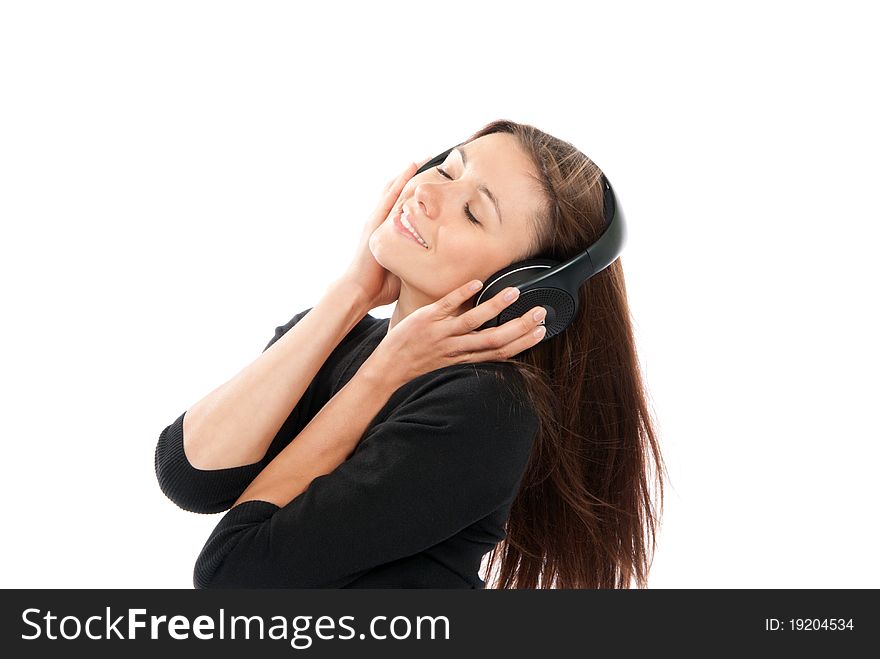 Brunette woman listen and enjoy the relax music in headphones, smiling, laughing and not looking in camera isolated on a white background. Brunette woman listen and enjoy the relax music in headphones, smiling, laughing and not looking in camera isolated on a white background