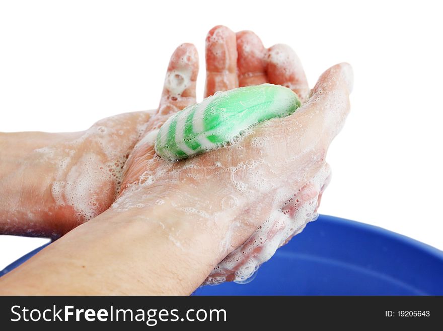 Man hands in the soapsuds on the white. Man hands in the soapsuds on the white