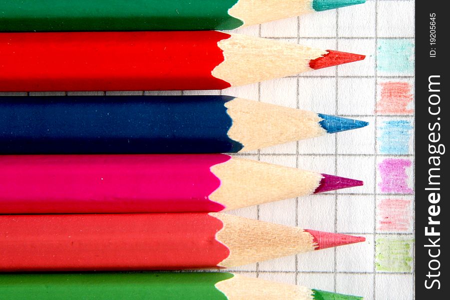 Colored pencils lying close to each other