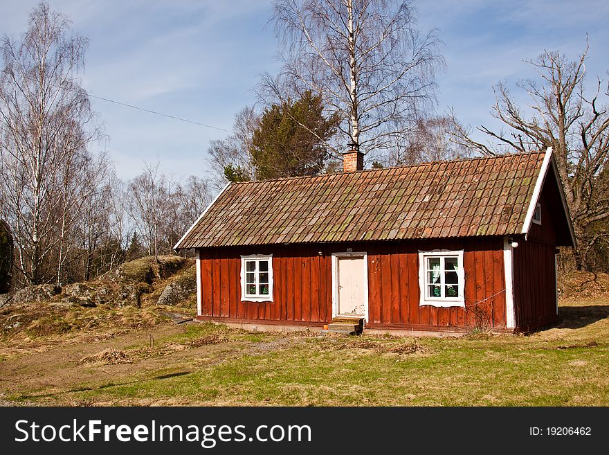 A red old typical summer house in Sweden. A red old typical summer house in Sweden.