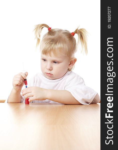 Child Playing With A Syringe