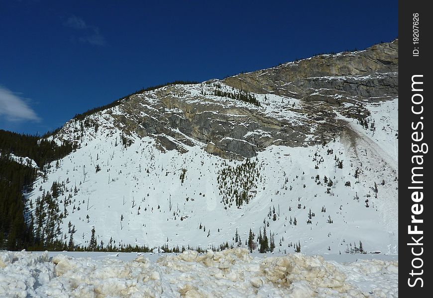 Beautiful snowy mountains in the blue skies of Jasper National Park Canada. Beautiful snowy mountains in the blue skies of Jasper National Park Canada