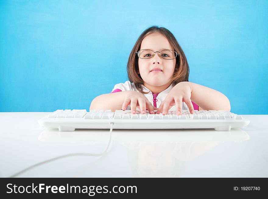 A little girl chatting in internet