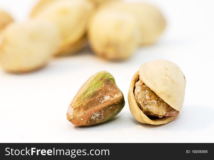 Pistachios on a white background, close up