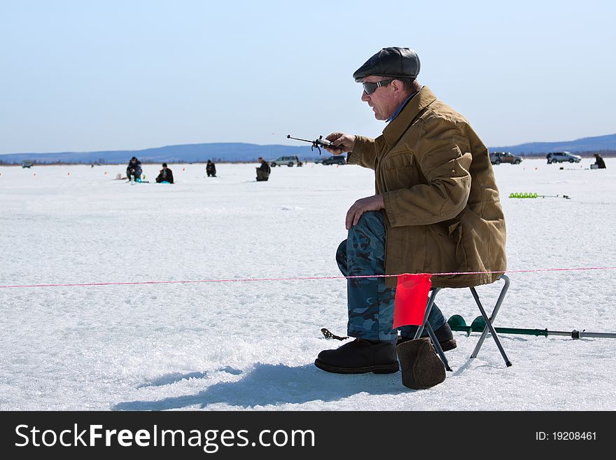 Fisherman on winter fishing. Russia, Transbaikalia. Fisherman on winter fishing. Russia, Transbaikalia.