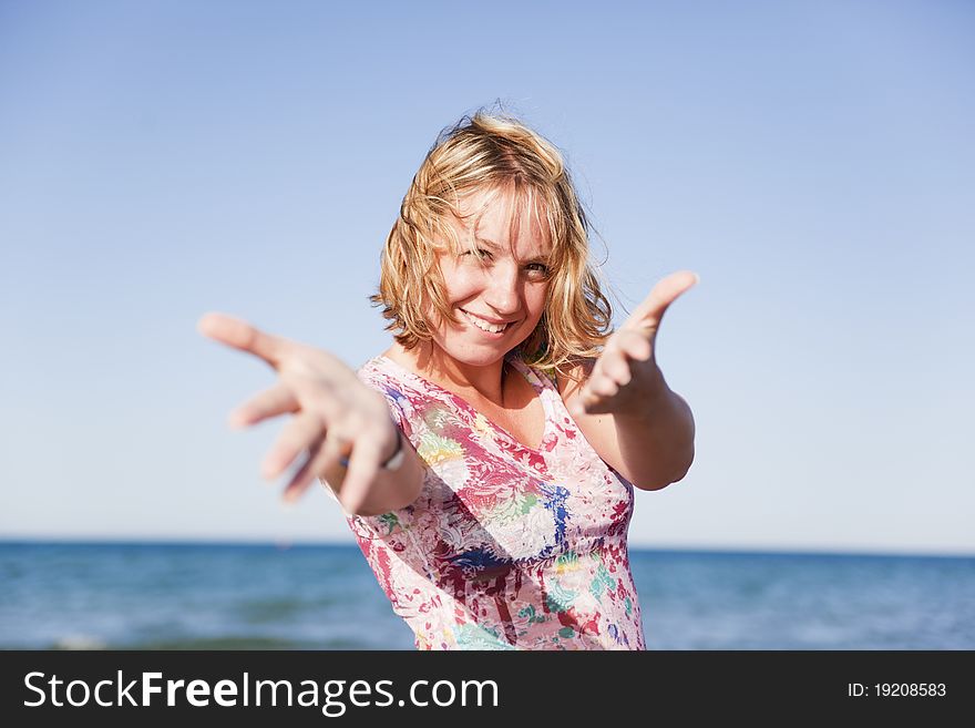 Beautiful Smiling Girl On The Beach