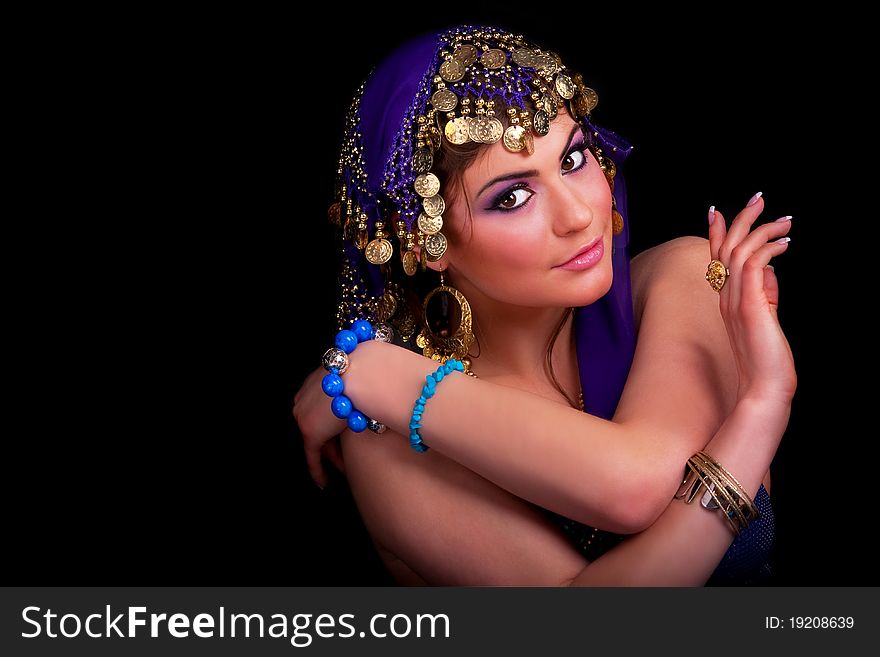 Beautiful girl in a stylized ethnic costume and shawl