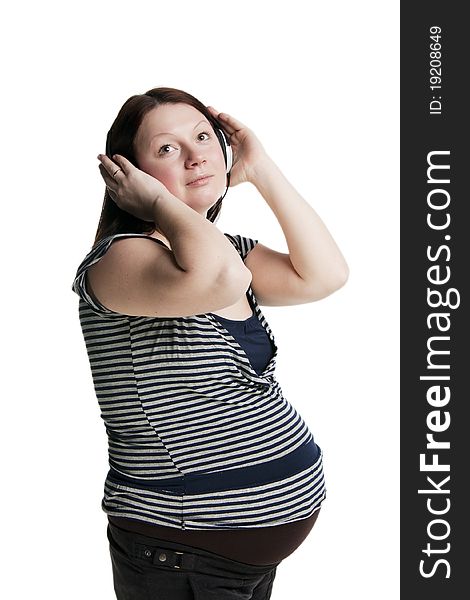 Pregnant woman listens to music