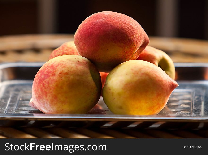 Fresh chinese peaches on salver