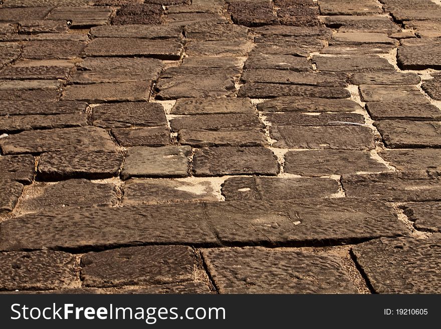 Old ruined paving blocks background