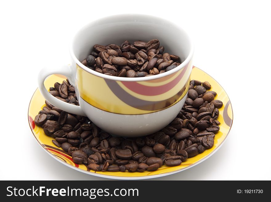 Coffee beans in the coffee cup with lower plate