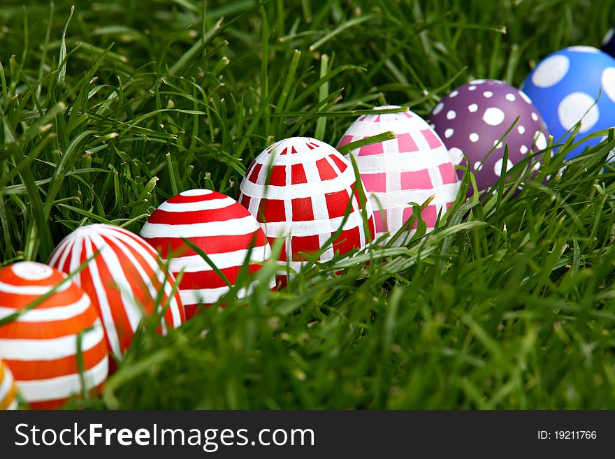 Hand-painted Easter eggs, hidden in the grass