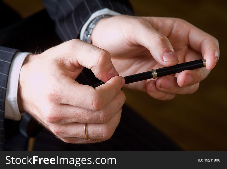 The hands of men who hold the pen. Business style