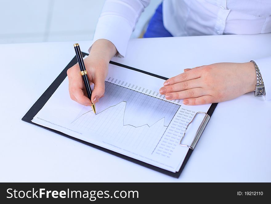 Business woman working with documents in the office. Business woman working with documents in the office