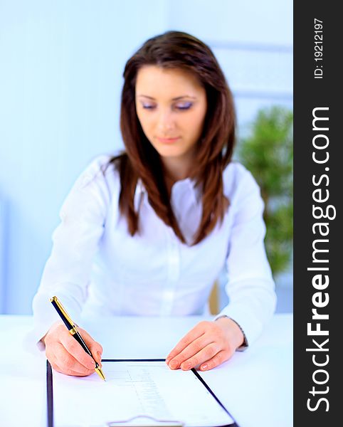 Beautiful business woman working at desk