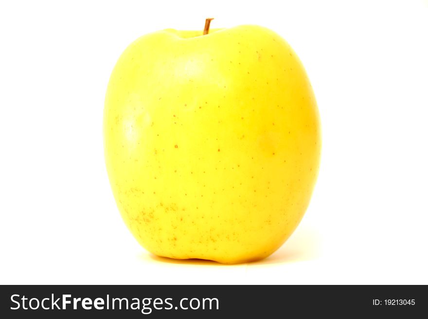 Yellow apple on a white background