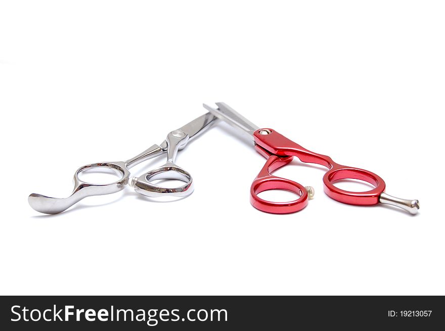 Pair of scissors for hairdressers on a white background