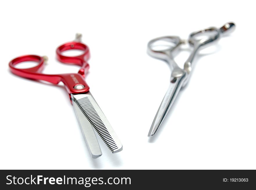 Pair of scissors for hairdressers on a white background