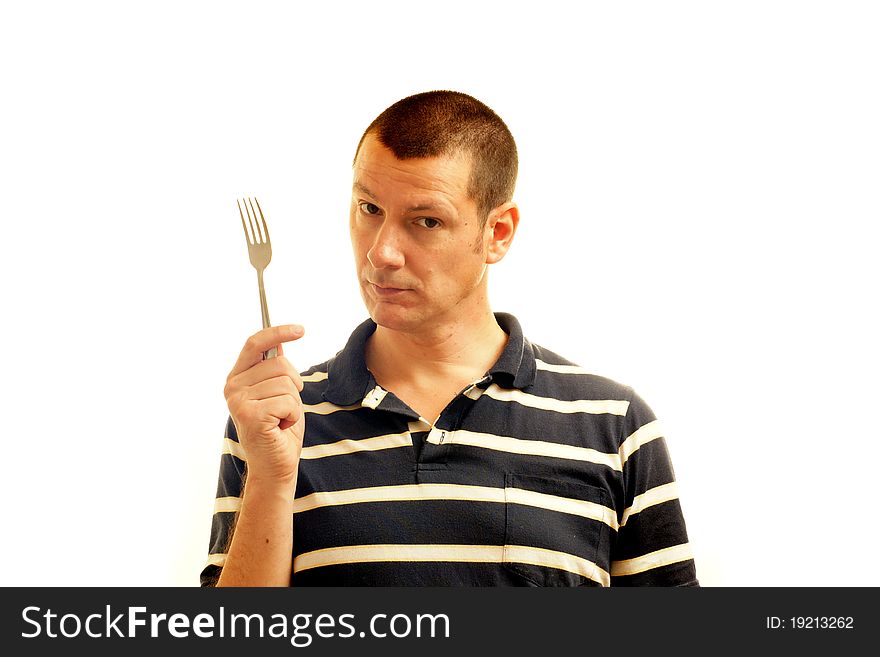 A man on a white background holds a fork - the symbol of potential. A man on a white background holds a fork - the symbol of potential.