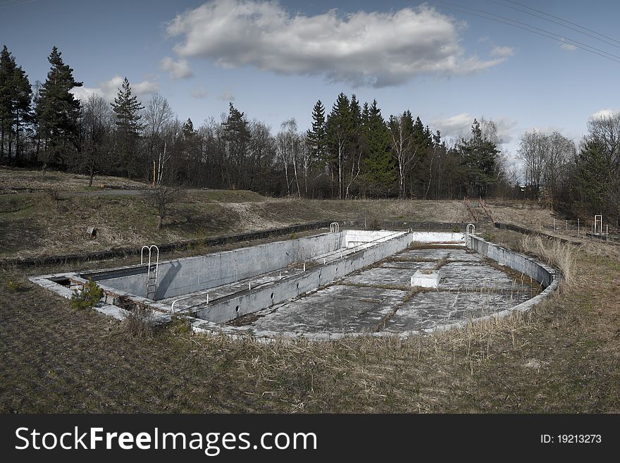 Empty abandoned swimming pool panorama