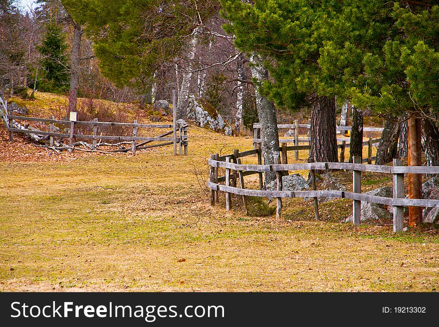 A wooden fence on a field