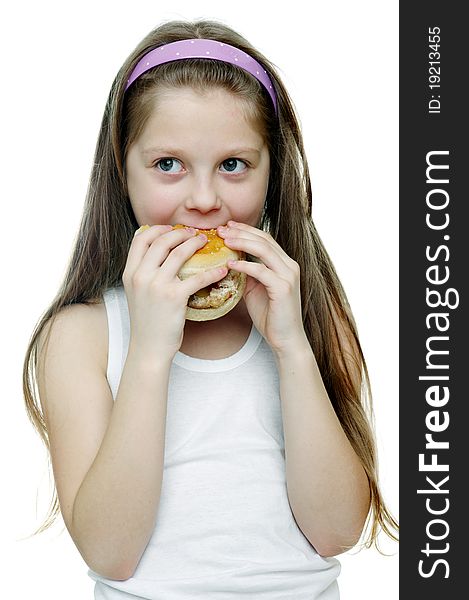 An image of a little girl eating a sandwich. An image of a little girl eating a sandwich