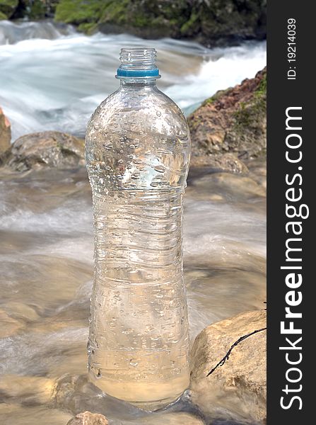 Spring water and plastic bottle
