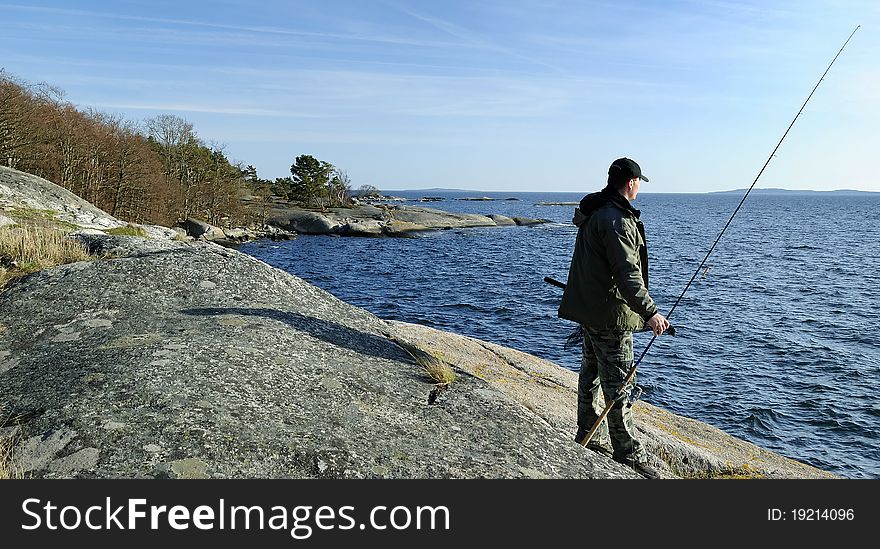 Angler On A Coast