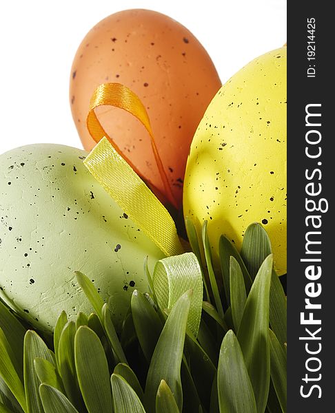 Colorful traditional Easter decoration with grass and artificial eggs