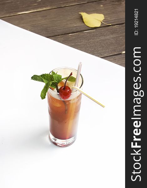Alcohol cocktail with cherry and mint