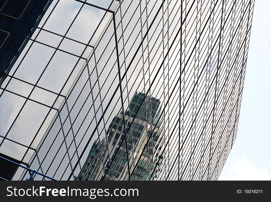 The upper facade of a large london skyscraper building. The upper facade of a large london skyscraper building