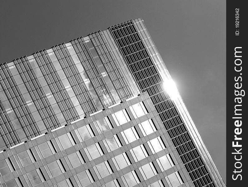 The upper facade of a large london skyscraper building. The upper facade of a large london skyscraper building