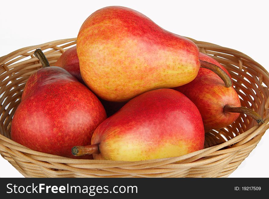 Pears in brown basket on a white background. Pears in brown basket on a white background