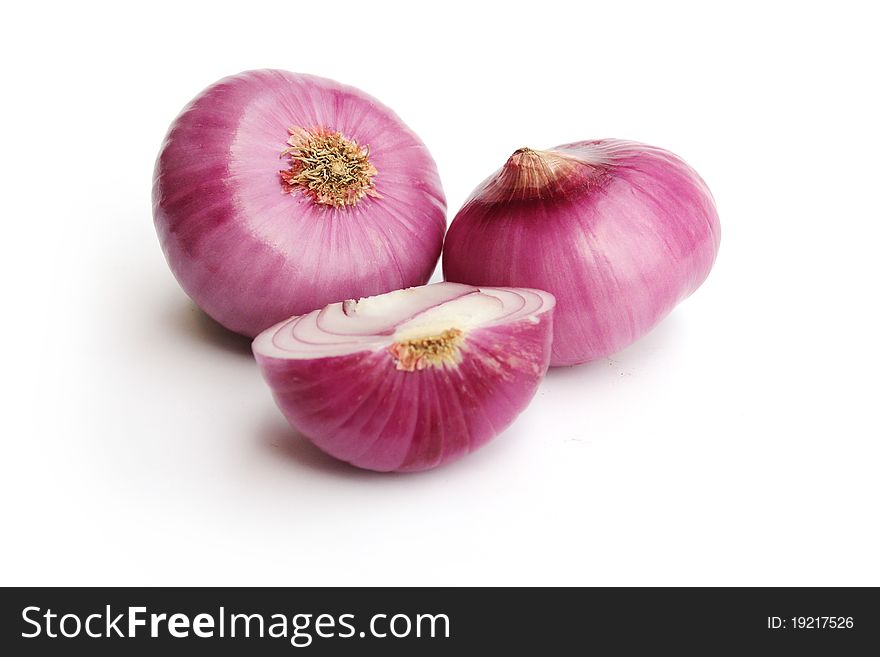 Two red onion on white background.