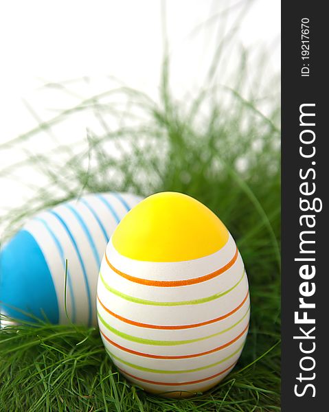 Striped Easter Eggs In Green Grass