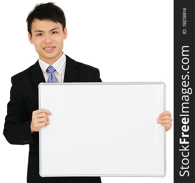 An Asian businessman holding a blank whiteboard. An Asian businessman holding a blank whiteboard