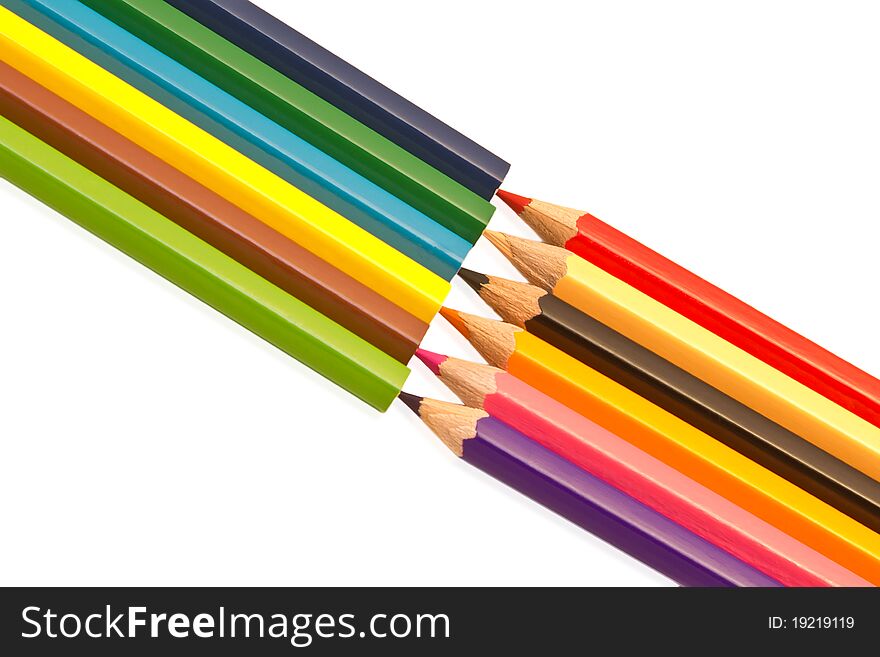 Small colored pencils isolated on white background