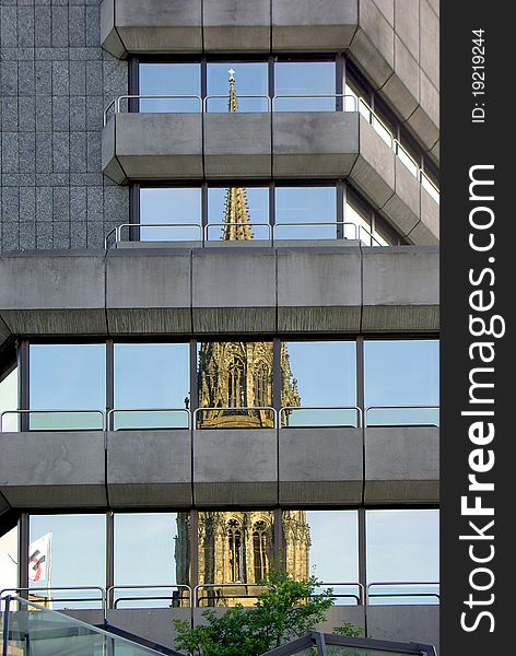 Modern building with the reflection of Cathedral
