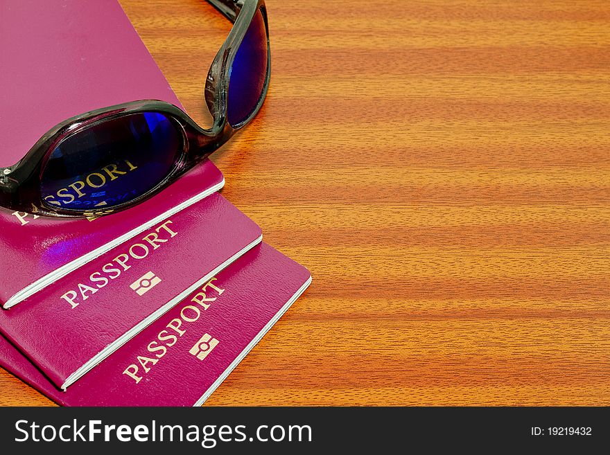 Passports and sunglasses holiday concept. Passports and sunglasses holiday concept