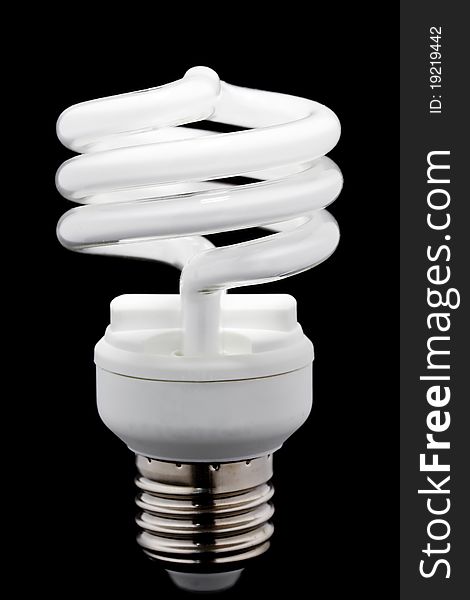 Energy saving bulb on black background