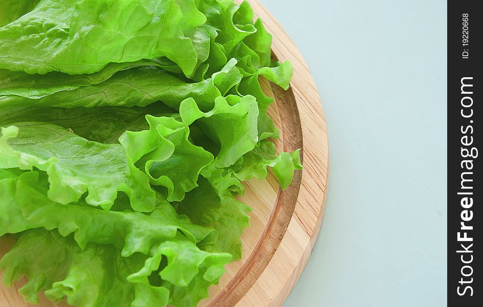 Fresh green salad on the breadboard