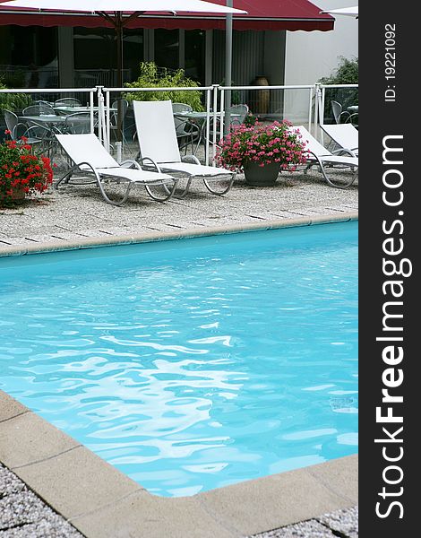 Furniture recliner gardens around a pool