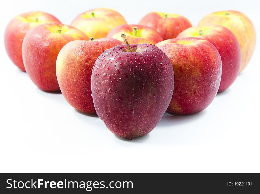 Red apples arranged on a white background.