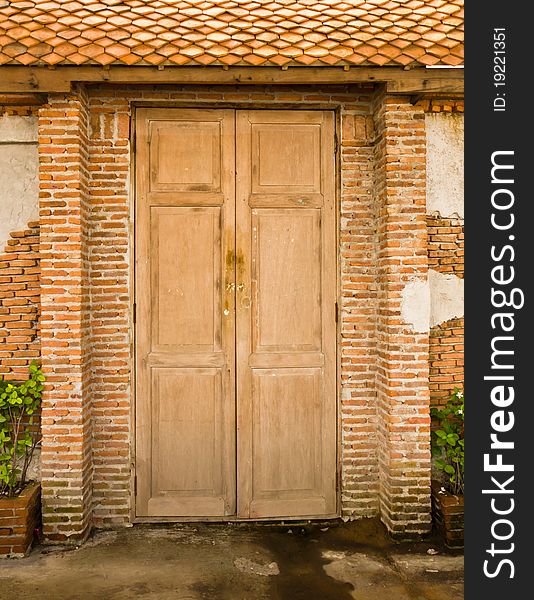 Grunge door background with brick wall. Grunge door background with brick wall